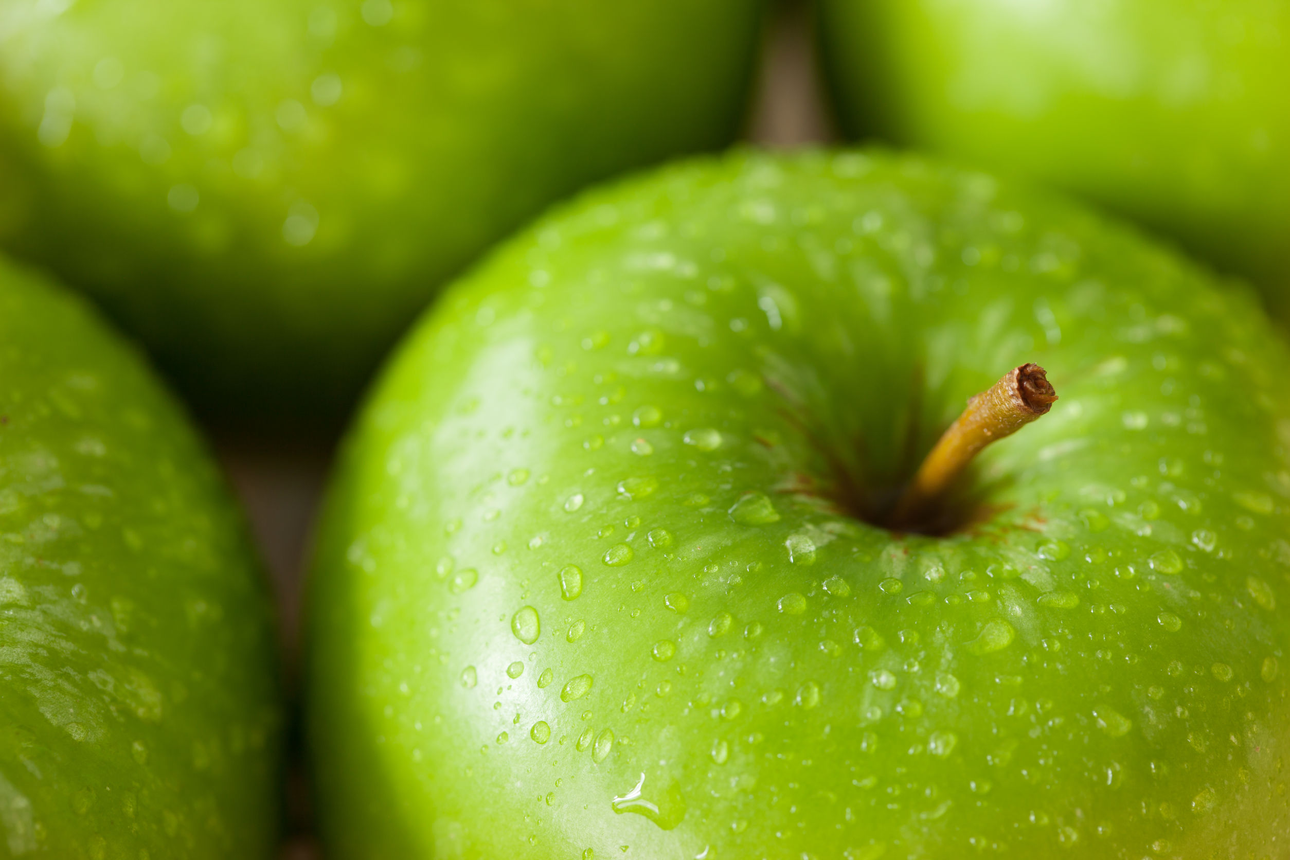 43624345 - green apple with water drop close up