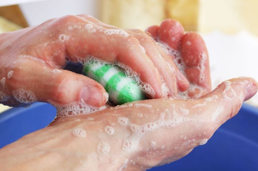 6244101 - man washes hands by the green soap