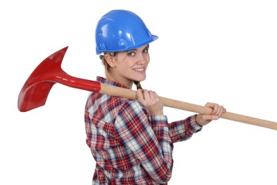 17578403 - woman carrying spade